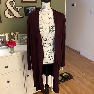 Pretty purple/burgundy colored buttonless sweater. Never worn. Still has tags!